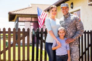 A soldier at home with his family