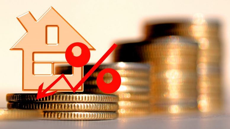 red percent on a background of money & house - the concept of changing prices in the market