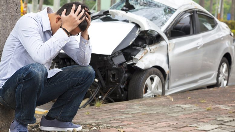 Man at a car accident scene