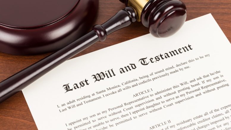 Last will and testament with a wooden gavel