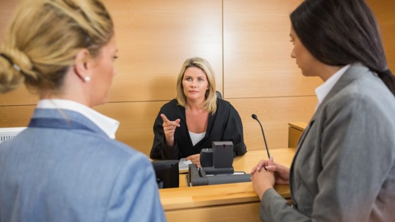 lawyers speaking with a judge